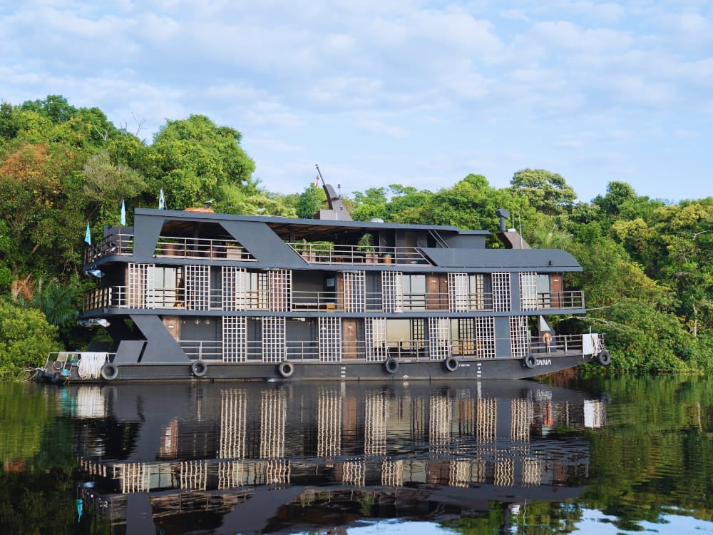 The Zaltana luxury riverboat floats calmly on the Rio Negro, offering high-end cruises through the Anavilhanas archipelago.
