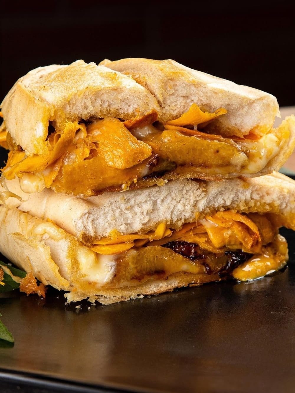 X-caboquinho-style sandwich: a French roll filled with orange Amazonian pulp and melted queijo coalho