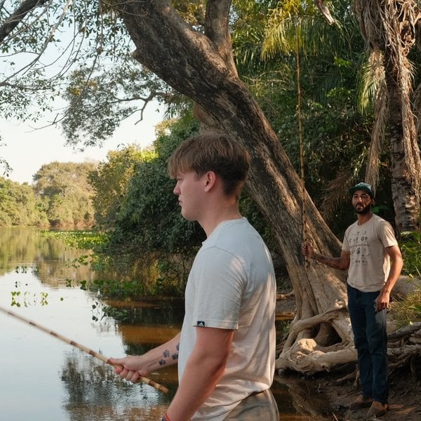 Sally's son fishing on the river with the local guide