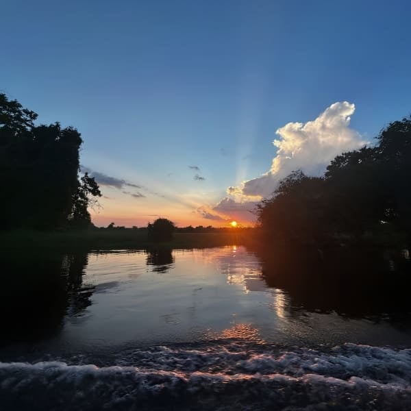 Sunset over the river seen from the boat in the Brazilian Amazon