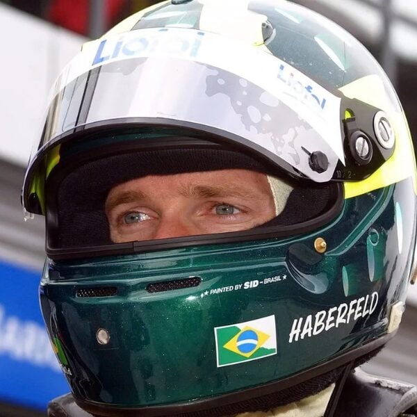 Close-up of Mario Haberfeld’s green racing helmet, with his surname and the Brazilian flag
