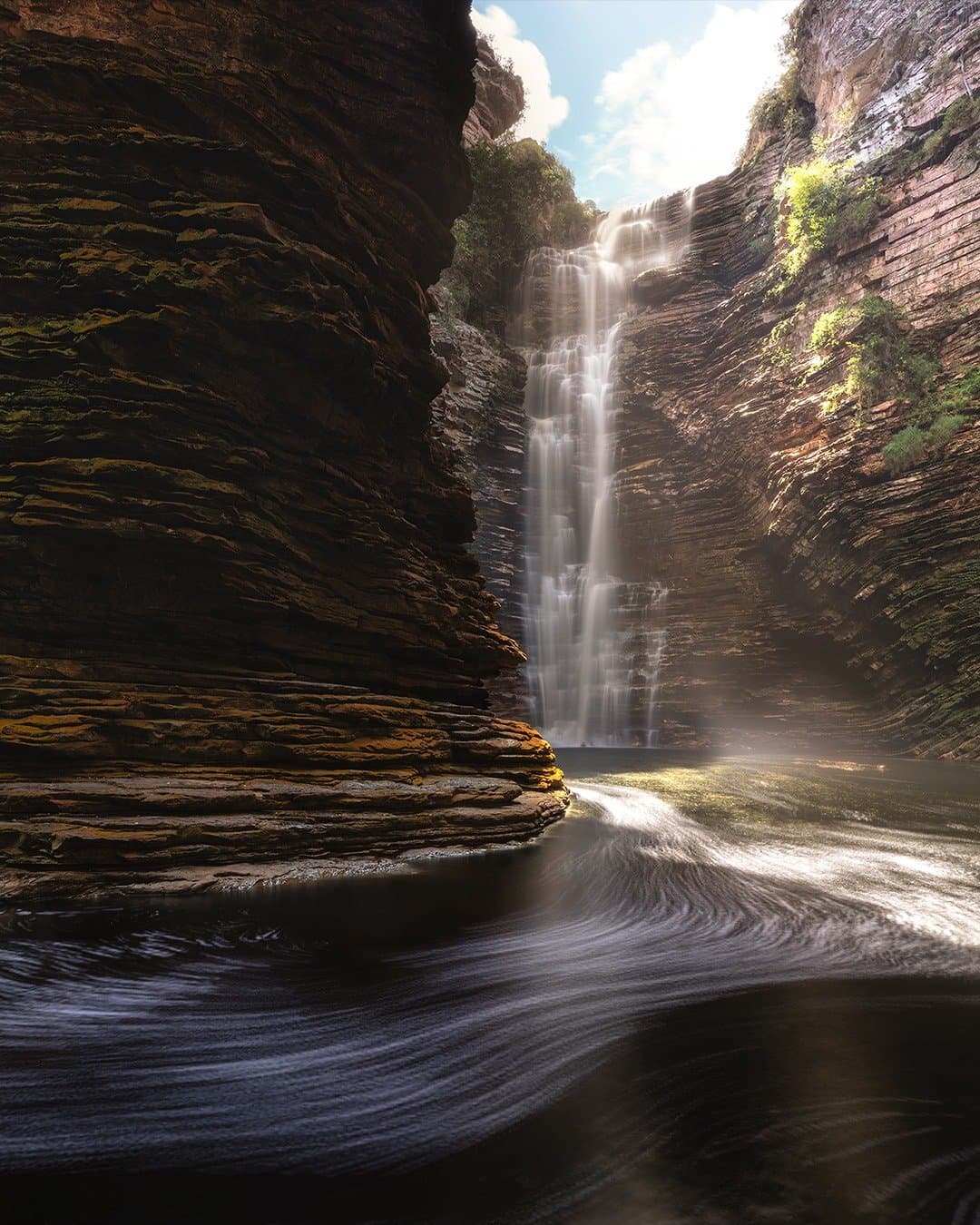 Sunlight pierces the gorge just long enough to set the mist aglow. Photo 3