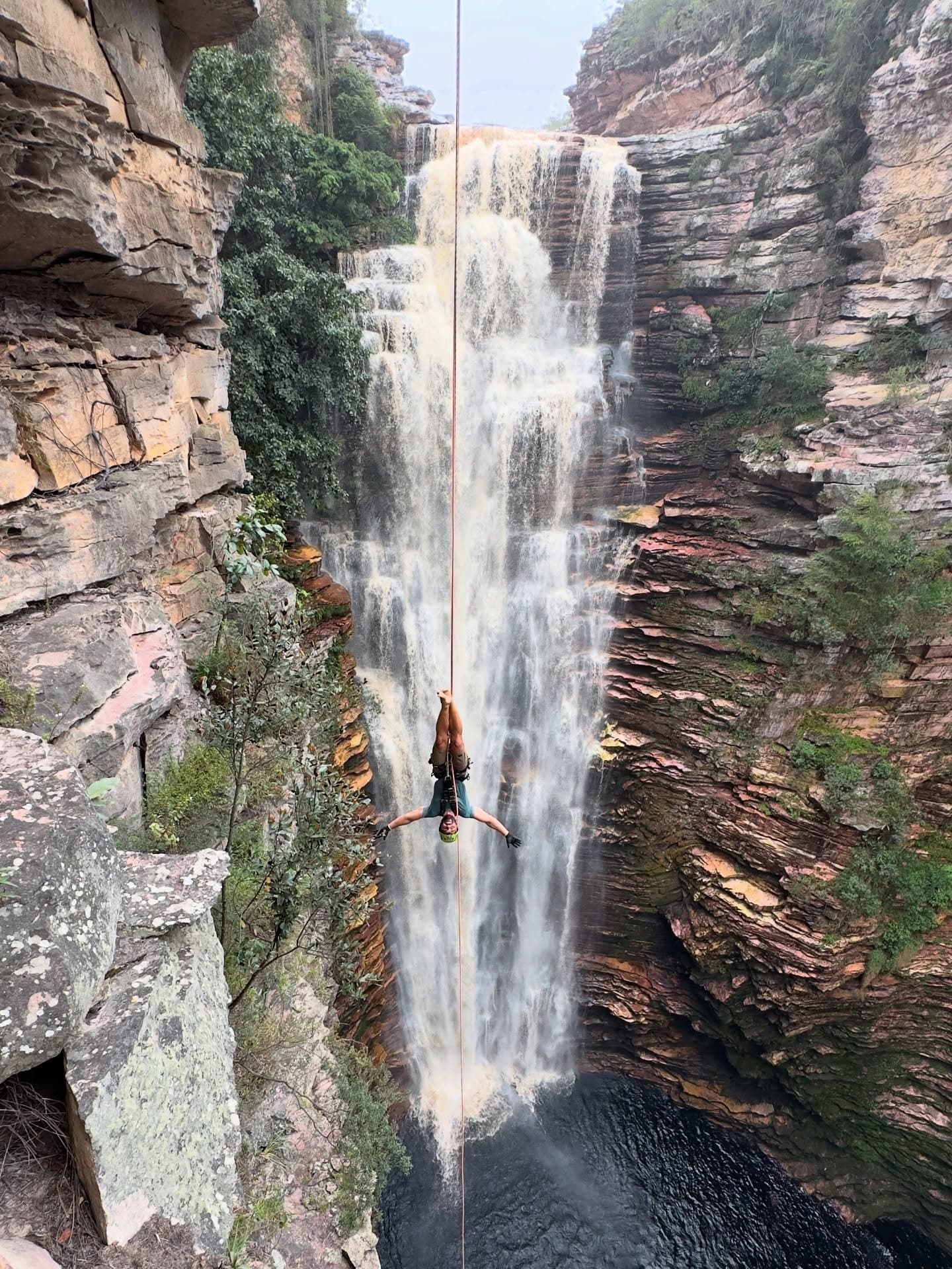 Rappelling face-up into the abyss, the canyon walls closing in on every side. Photo 4