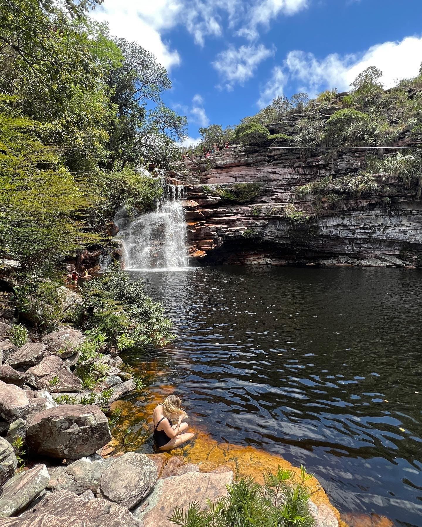 Cool water, warm sandstone — a moment of stillness beside a cascading waterfall. Photo 2
