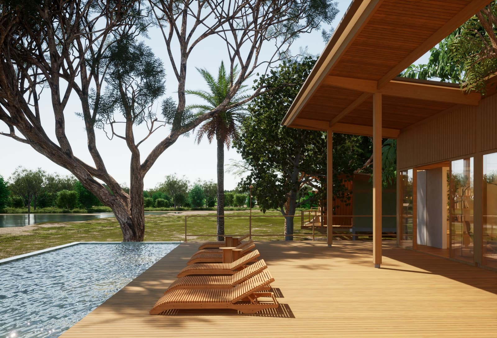 Safari bei Sonnenaufgang, kühles Getränk am Pool um Mittag. So erlebt man den Pantanal am besten. Photo: Lucio Fleury Hölzerne Sonnenliegen entlang eines Infinity-Pools auf der Terrasse einer Lodge für die Luxury Pantanal and Amazon Trip, mit einheimischen Bäumen und einem ruhigen Gewässer im Hintergrund