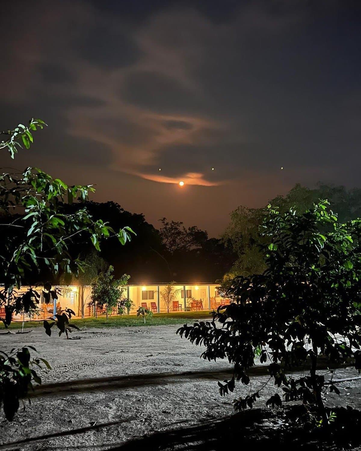 The lodge lit up at night feels like a small, quiet universe of its own. Photo 1